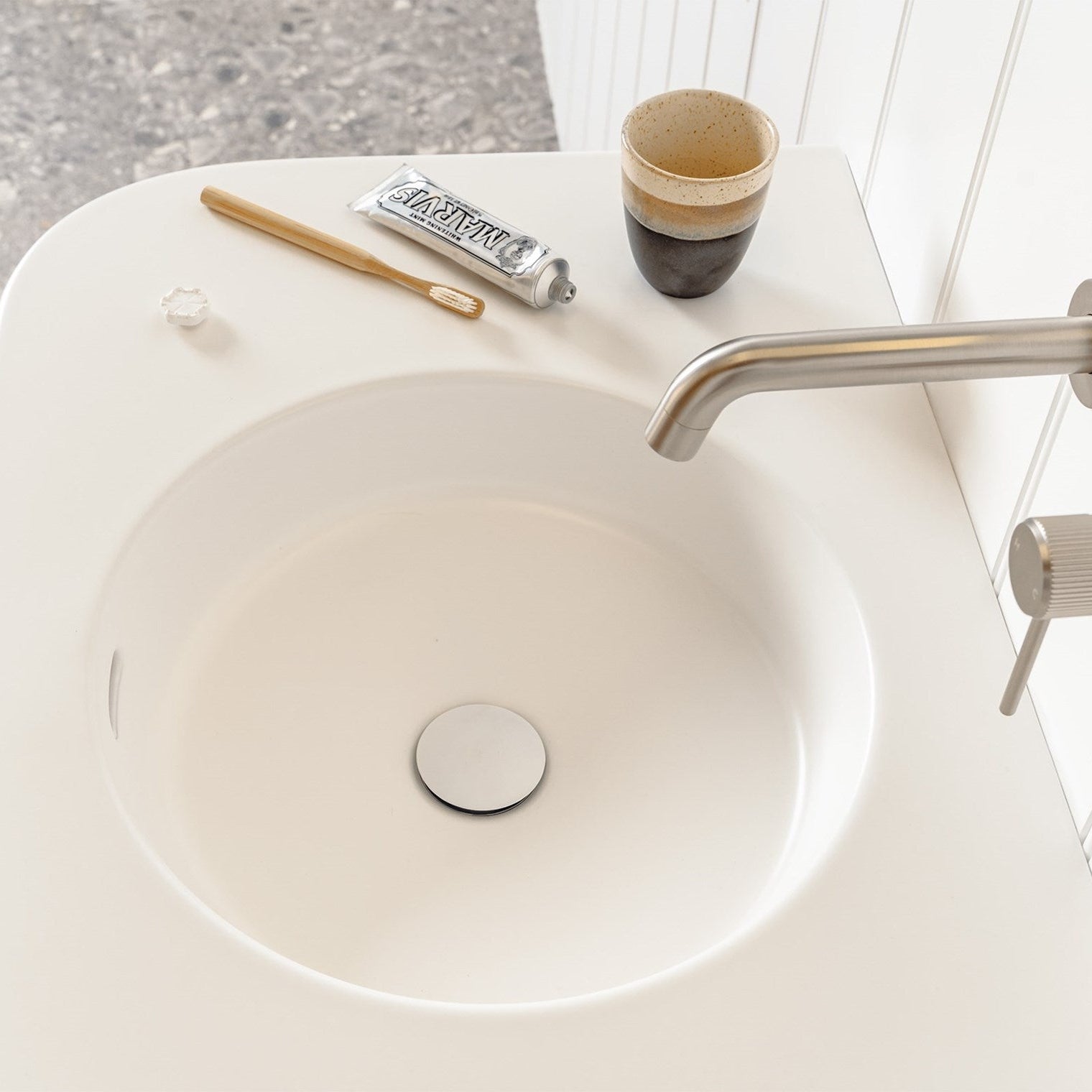 Curved matte ceramic moulded top with integrated front position overflow, designed in Australia

