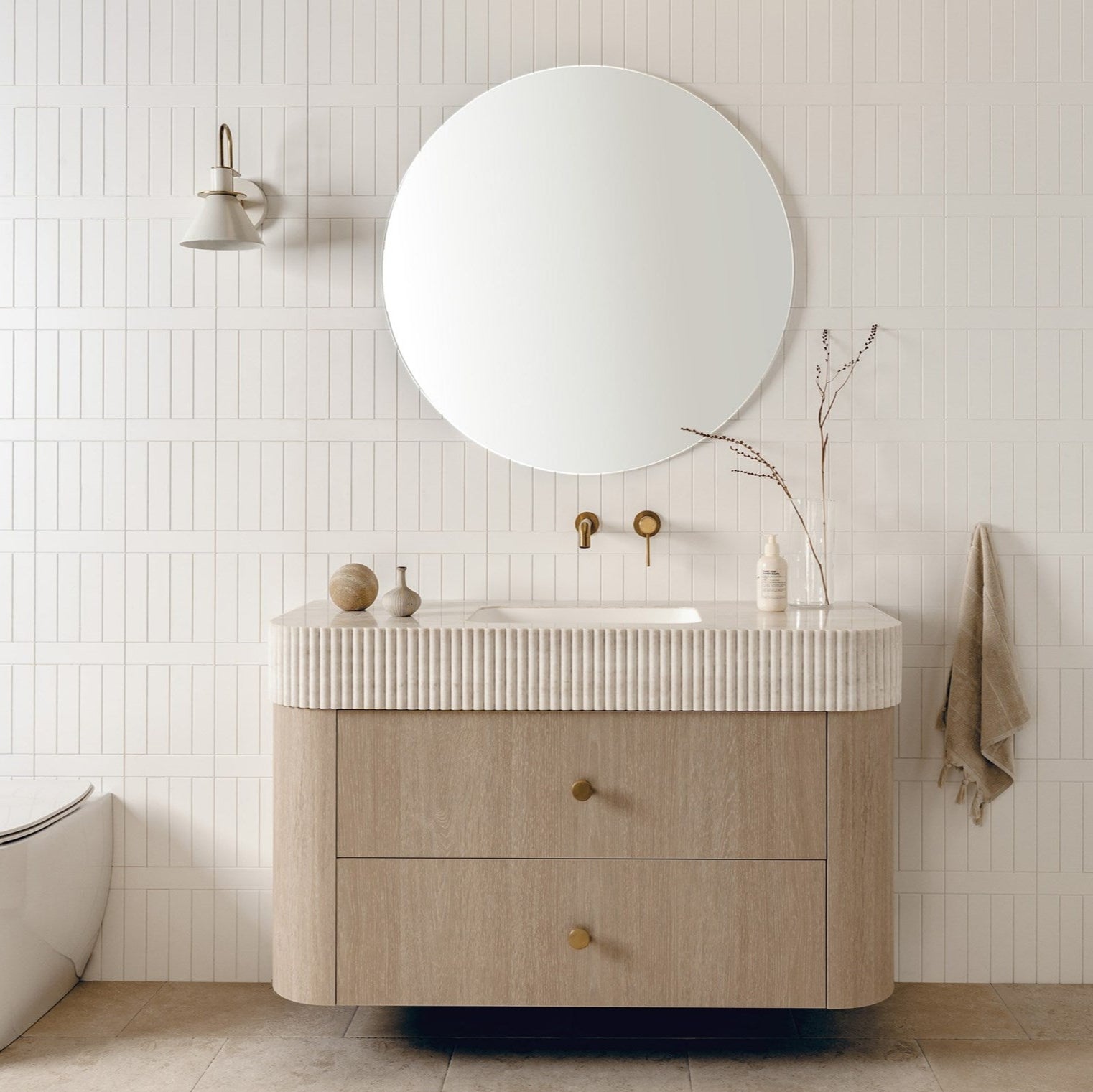 Thea 1200 Centre Bowl vanity, Coastal Oak cabinet finish, Imperial Top in Sakal Durasein and Cooper Knobs, Brushed Brass

Soul Wall Spout & Wall Mixer in Brushed Brass

Eclipse Mirror

