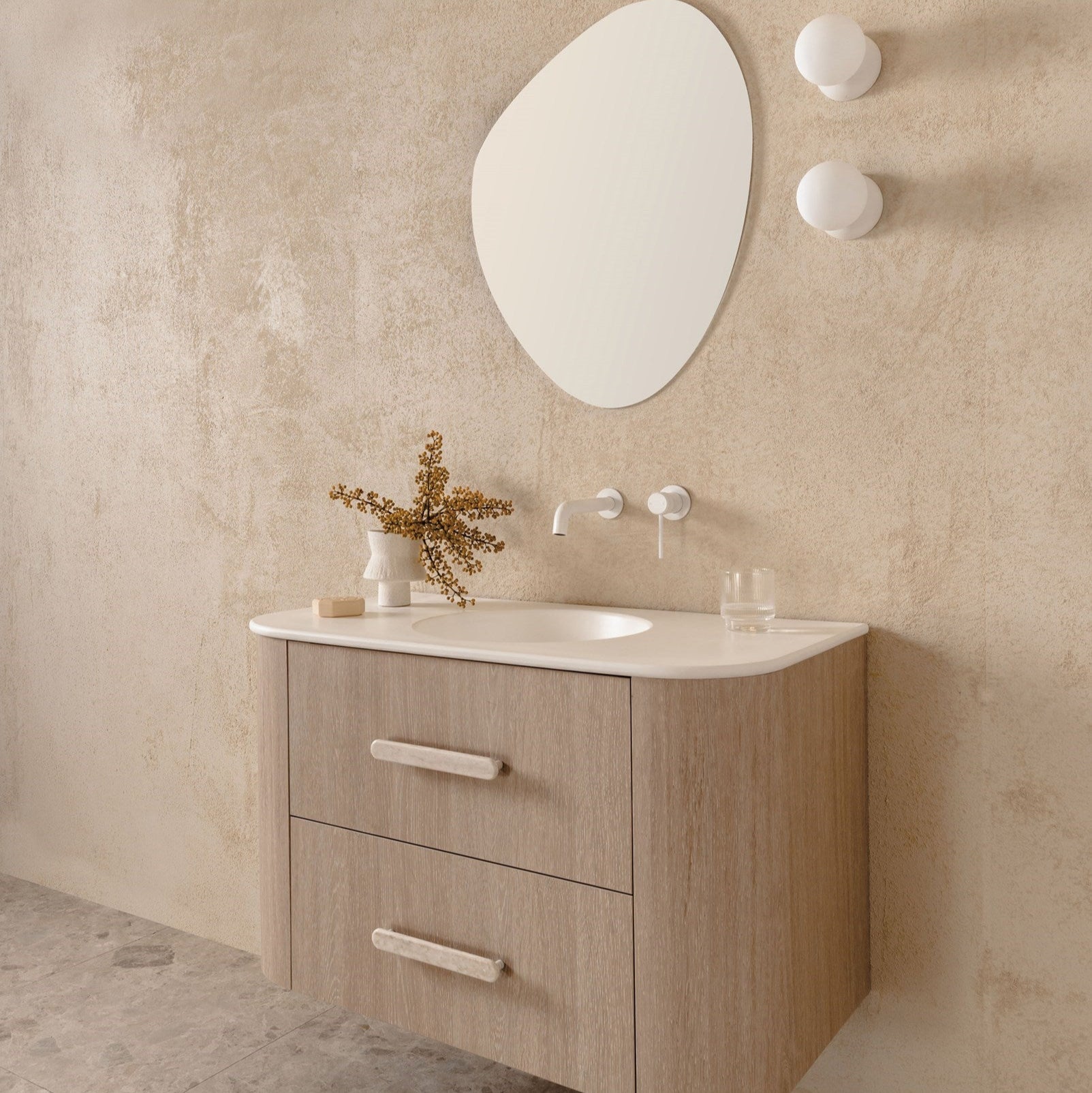 Thea 900 Centre Bowl vanity, Ceramic Moulded Top, Coastal Oak cabinet finish and Eden Handle in Sakal

Soul Wall Spout & Wall Mixer in Matte White

Pebble Mirror

